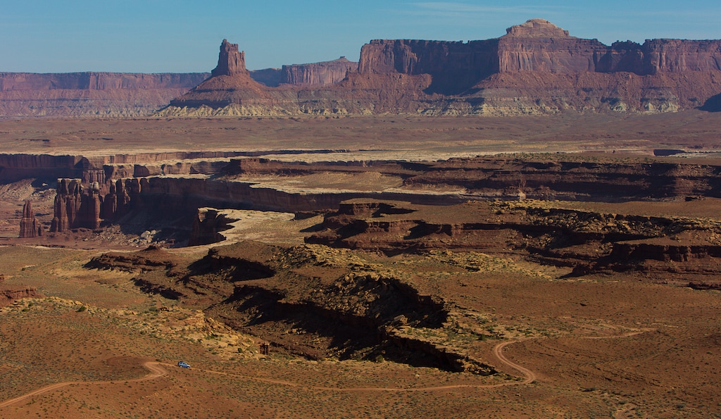 (Francisco Kjolseth | Tribune file photo) A four wheel drive car travels the road popular with mountain bikers that makes up the White Rim Trail in Canyonlands, Utah in May 2013.