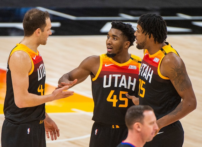 (Rick Egan | The Salt Lake Tribune) Utah Jazz guard Donovan Mitchell (45) forward Bojan Bogdanovic (44) Jazz center Derrick Favors (15), react as the Jazz extend their lead, in NBA action between the Utah Jazz and the Atlanta Hawks at Vivint Arena, on Friday, Jan. 15, 2021.