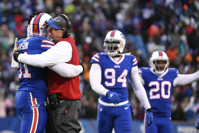 Buffalo Bills head coach Rex Ryan hugs Buffalo Bills' Manny Lawson (91) after Lawson intercepted a pass during the second half of an NFL football game against the New York Jets Sunday, Jan. 3, 2016, in Orchard Park, N.Y. The Bills won 22-17. (AP Photo/Gary Wiepert)