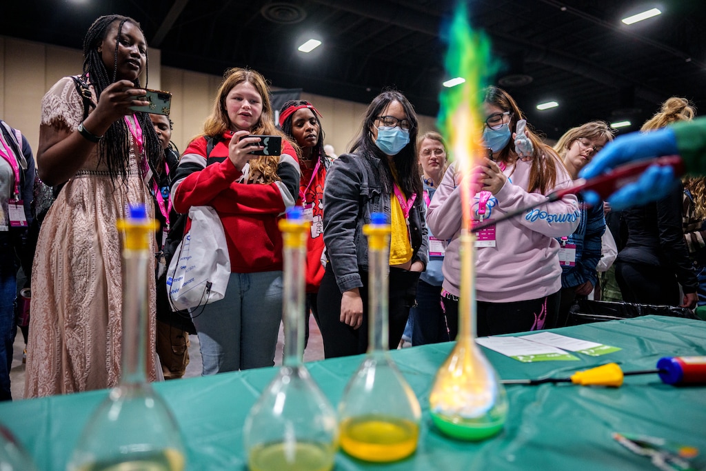 (Trent Nelson  |  The Salt Lake Tribune) Attendees watch experiments by Lakshmi Viswanath, Associate Professor in the Department of Chemistry at Utah Valley University, at SheTech Explorer Day in Sandy on Thursday, March 14, 2024.