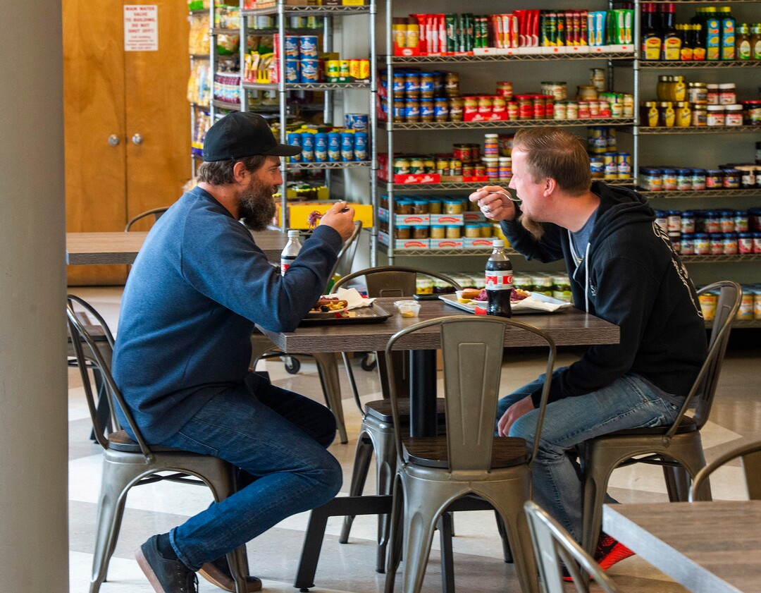 (Rick Egan  |  The Salt Lake Tribune)    Zac Flannery Rob Barber eat their lunch inside Siegfried's Delicatessen, which just opened up for indoor dining, Friday May 1, 2020