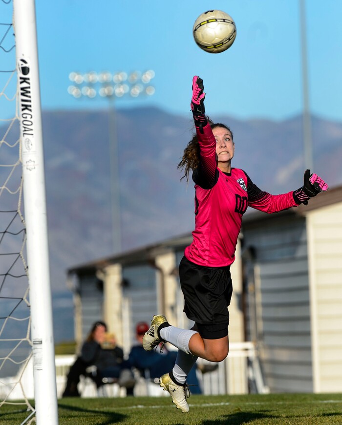 (Steve Griffin  |  The Salt Lake Tribune)  Copper Hills goal keeper McCaslin Davis stretches for a shot on goal during the Class 6A girls' soccer playoff game against Davis at Copper Hills High School in West Jordan Tuesday October 10, 2017.
