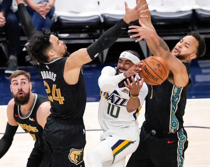 (Leah Hogsten | The Salt Lake Tribune) Utah Jazz guard Mike Conley (10) is heavily pressured at the net as the Utah Jazz take on the Memphis Grizzlies during Game 1 of the first-round playoffs at Vivint Arena, May 23, 2021.