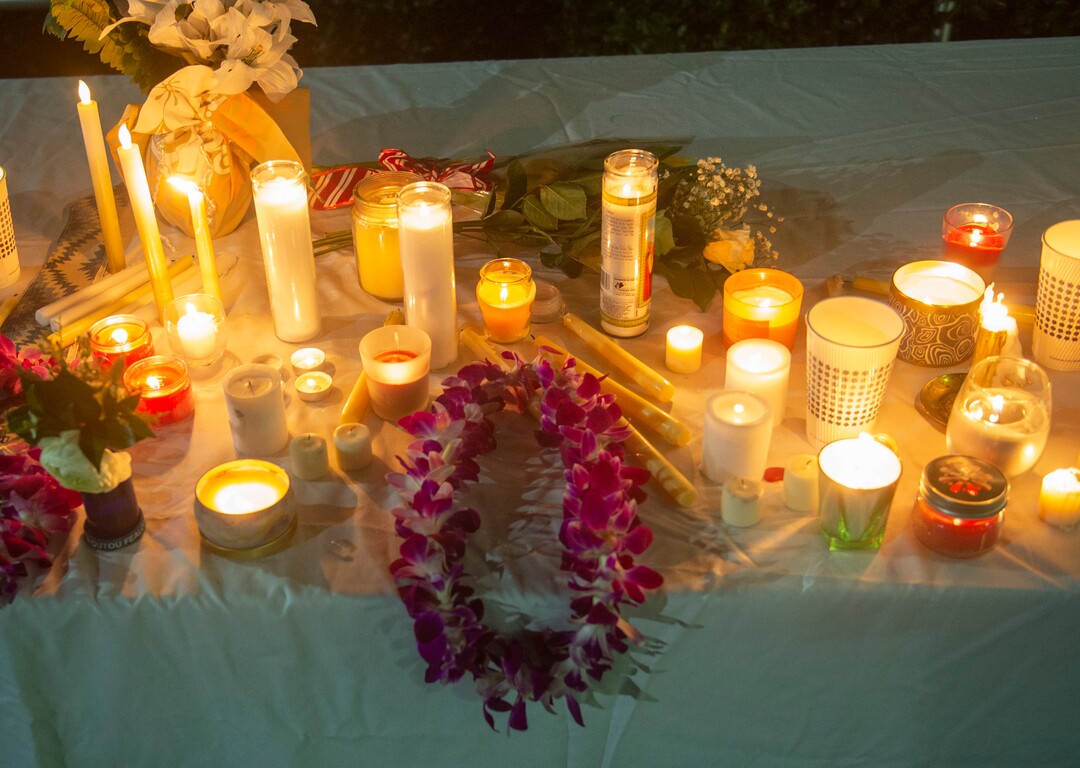 (Rick Egan  |  The Salt Lake Tribune)       BYU students place flowers and candles at the entrance of the Tanner building during a candlelight vigil on BYU campus, for the student who died by suicide this week, Friday, Dec. 7, 2018.  