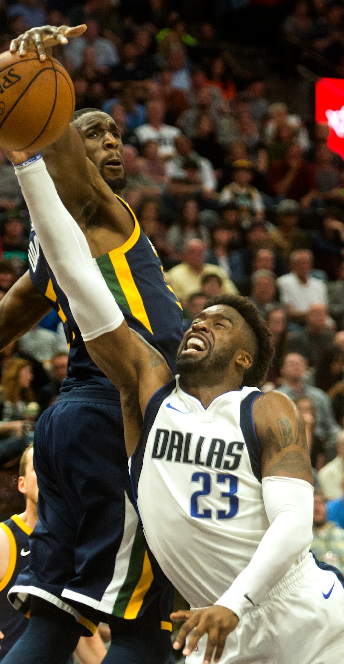 (Rick Egan  |  The Salt Lake Tribune) Dallas Mavericks guard Wesley Matthews (23) tries to get to the hoop, as Utah forward Ekpe Udoh (33) defends for the Jazz, in NBA action Utah Jazz vs. Dallas Mavericks, in Salt Lake City, Monday, October 30, 2017.