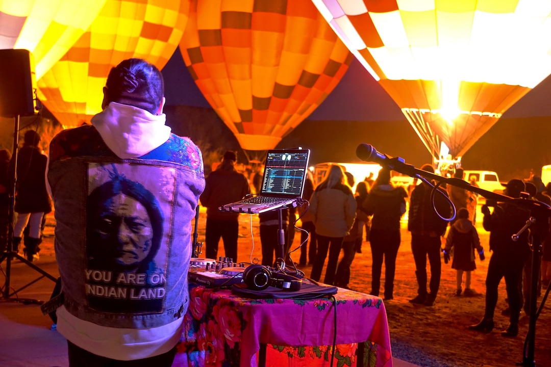 (Zak Podmore | The Salt Lake Tribune) Krieg Benally of Neon Nativez DJs at the Bluff International Balloon Festival on Saturday, Jan. 18, 2020.