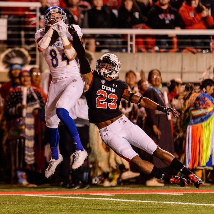 (Trent Nelson | The Salt Lake Tribune)  San Jose State Spartans wide receiver Bailey Gaither (84) pulls in a touchdown pass, defended by Utah Utes defensive back Julian Blackmon (23), as the Utah Utes host the San Jose State Spartans, NCAA football at Rice-Eccles Stadium in Salt Lake City, Saturday September 16, 2017.