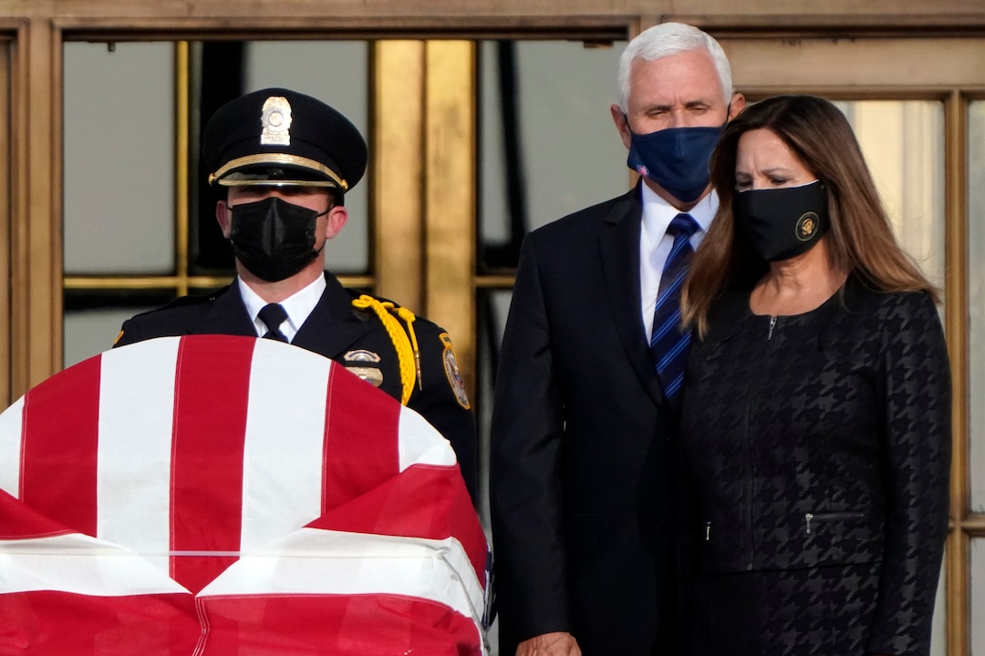 Vice President Mike Pence and his wife Karen Pence pay their respects as Justice Ruth Bader Ginsburg lies in repose under the Portico at the top of the front steps of the U.S. Supreme Court building in Washington, Wednesday, Sept. 23, 2020. Ginsburg, 87, died of cancer on Sept. 18. (AP Photo/J. Scott Applewhite)