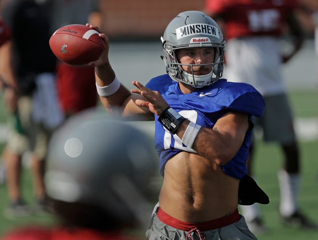 (AP Photo/Ted S. Warren) Washington State quarterback Gardner Minshew passes during NCAA college football practice, Thursday, Aug. 16, 2018, in Pullman, Wash. Minshew is one of three quarterbacks competing for the starting job.