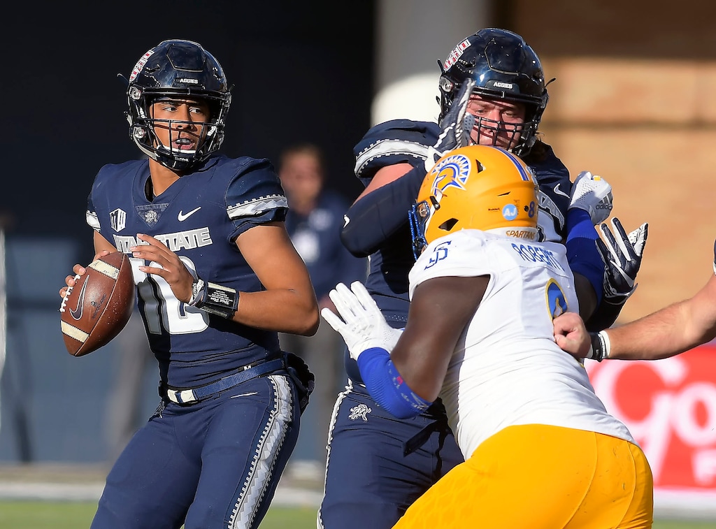 (Eli Lucero | The Herald Journal via AP) Utah State quarterback Jordan Love (10) looks for a receiver during an NCAA football game against San Jose State on Nov. 10, 2018, in Logan, Utah.