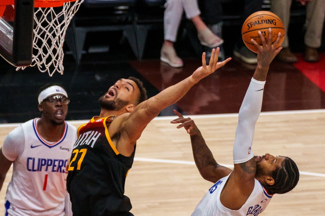 (Trent Nelson  |  The Salt Lake Tribune) LA Clippers guard Paul George (13) pulls down a rebound, with Utah Jazz center Rudy Gobert (27) at left, as the Utah Jazz host the Los Angeles Clippers in a Game 5 matchup, NBA basketball in Salt Lake City on Wednesday, June 16, 2021.