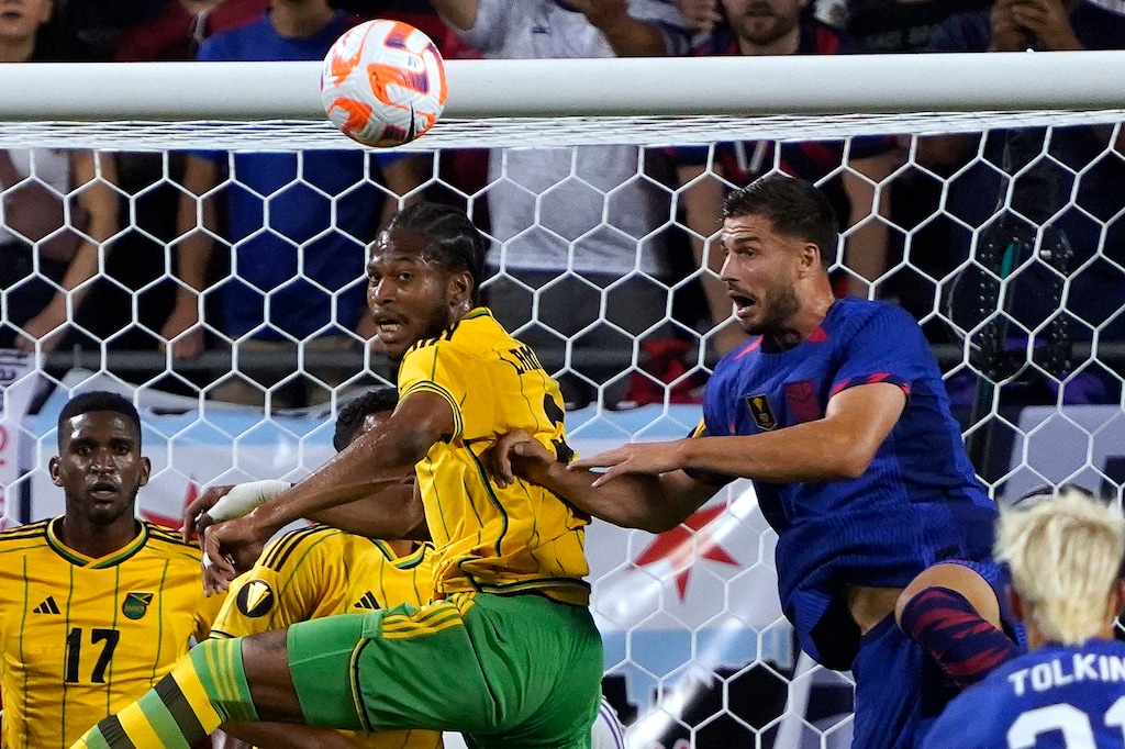 (David Banks | AP) Jamaica midfielder Kevon Lambert, center, and U.S. defender Matt Miazga, right, go for the ball during the first half of a CONCACAF Gold Cup soccer match Saturday, June 24, 2023, in Chicago. Lambert is headed to Real Salt Lake from Phoenix Rising in the USL.