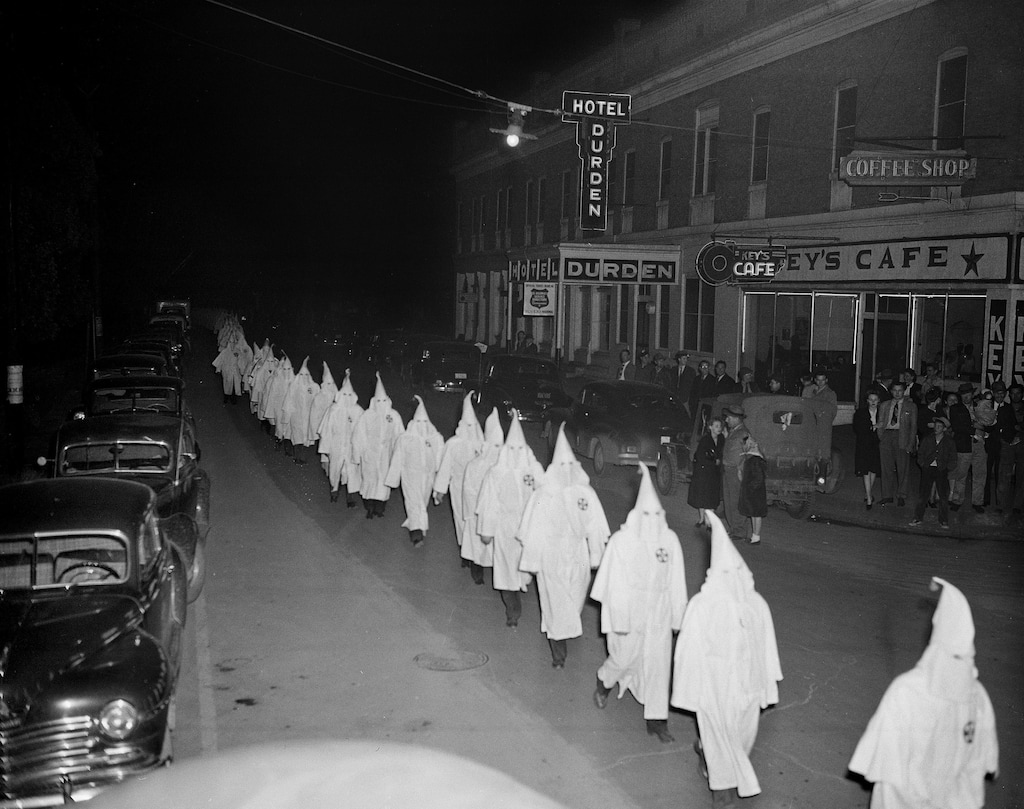 (AP Photo/File)
In this Feb. 3, 1948, photo, members of the Ku Klux Klan wear white hoods and robes as they march in single file around the town square in Swainsboro, Ga., on their way to the Emanuel County Courthouse where they burned a cross on the lawn.