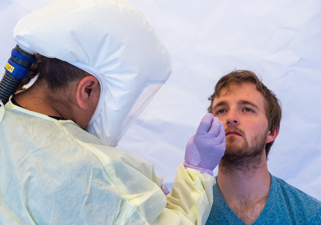 (Rick Egan  |  The Salt Lake Tribune)   Intermountain Healthcare medical assistant, Latoya Dovila, tests Preston Jenson, at the  Intermountain Healthcare Coronavirus Mobile Testing Unit at Utah Valley Hospital in Provo, Friday May 8, 2020