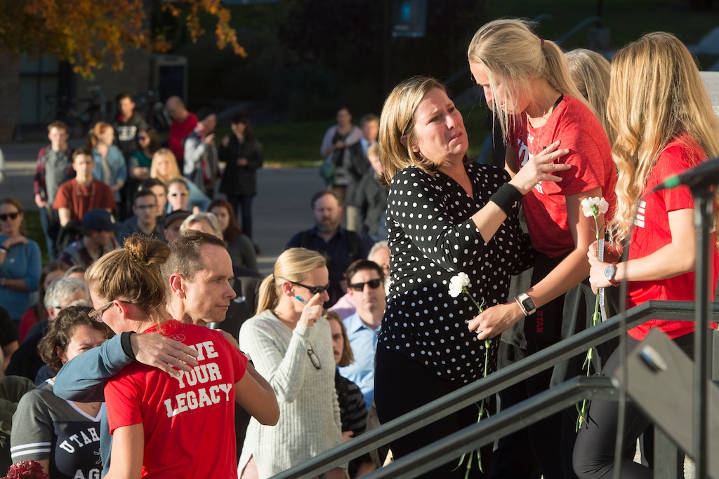 (Jeremy Harmon  |  The Salt Lake Tribune) Lauren McCluskey's parents, Matt and Jill McCluskey, hug some of their daughter's teammates after a vigil at the University of Utah on Wed. Oct 24, 2018. McCluskey was killed on campus on Monday.