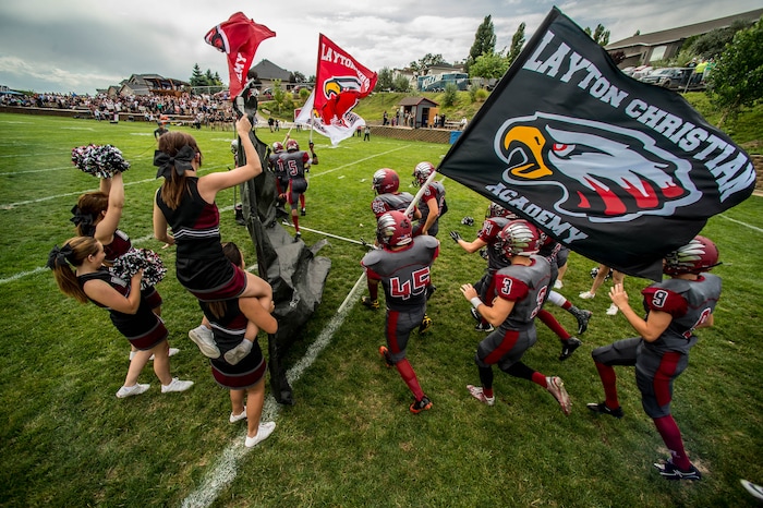 Trent Nelson  |  The Salt Lake TribuneLayton Christian takes the field for their home opener, hosting Duchesne, high school football in Layton Thursday August 21, 2014.