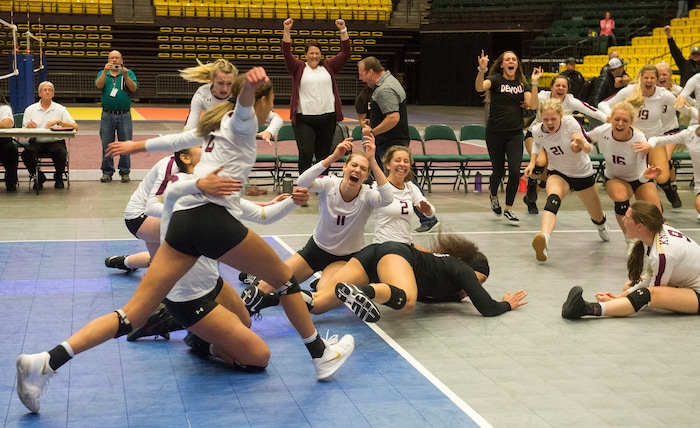 (Rick Egan  |  The Salt Lake Tribune)    The Lone Peak Knights celebrate their win over the Pleasant Grove Vikings, for the 6A volleyball championship, at Utah Valley University, Saturday, November 4, 2017.