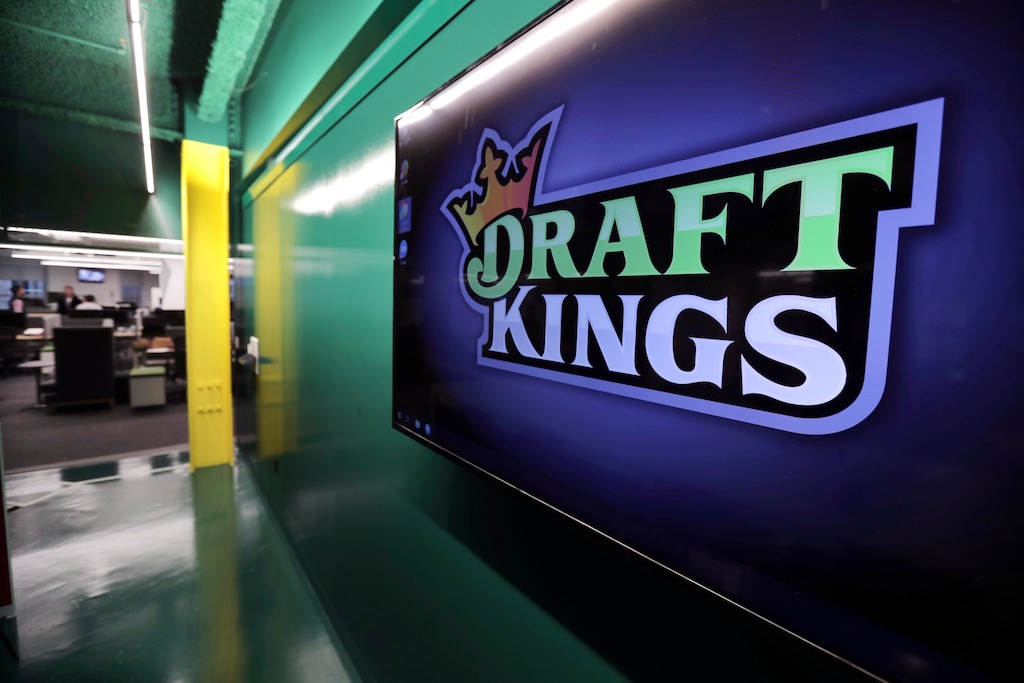 (Charles Krupa | AP) The DraftKings logo is displayed at the sports betting company headquarters, May 2, 2019, in Boston.
