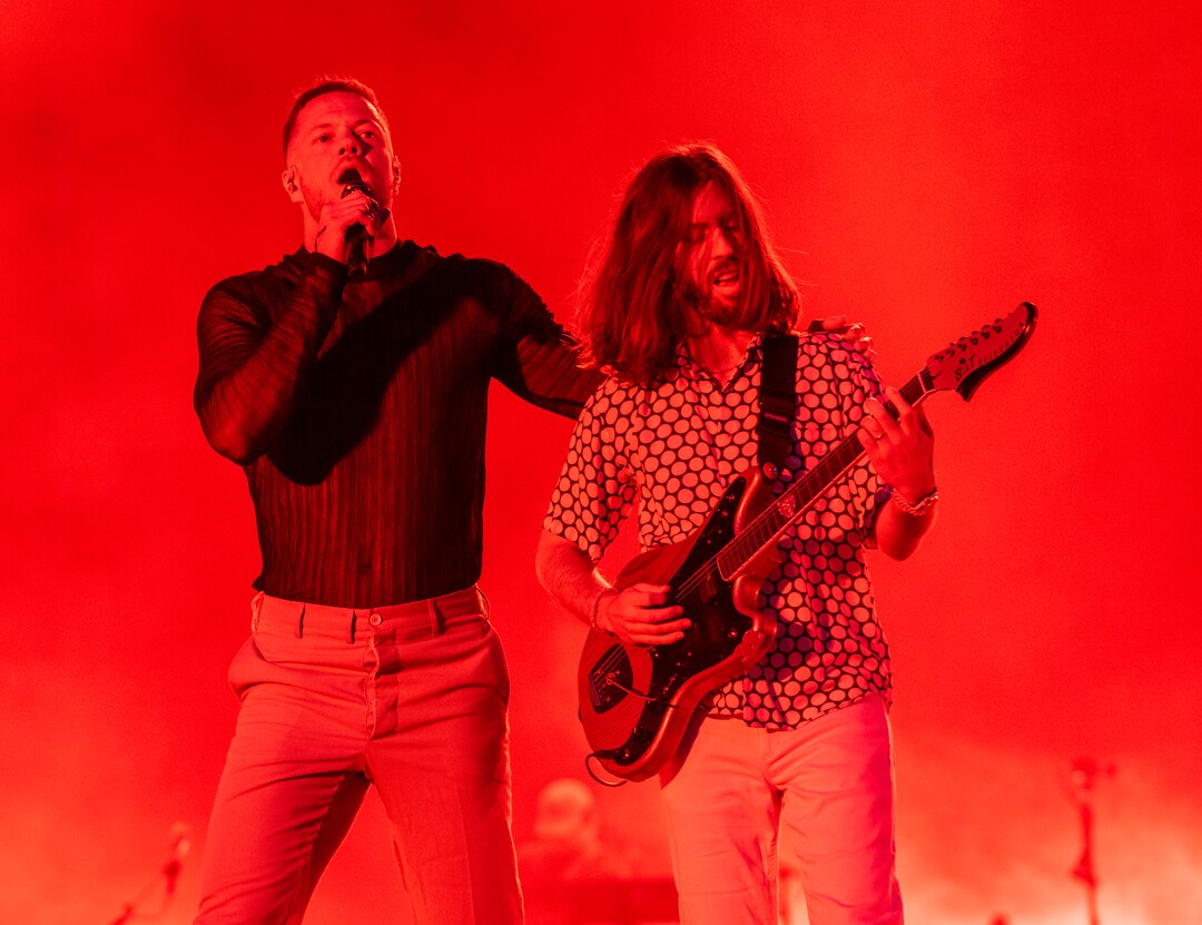 (Rick Egan | The Salt Lake Tribune) Dan Reynolds sings and Wayne Sermon plays guitar as Imagine Dragons performs at Rice-Eccles Stadium, on Friday, Aug. 5, 2022.