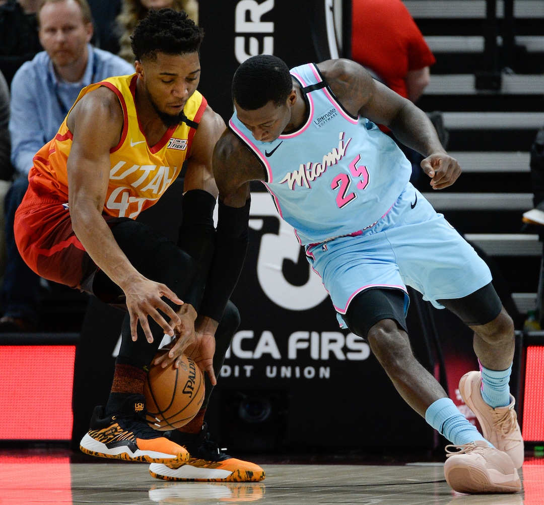 (Francisco Kjolseth  |  The Salt Lake Tribune) Utah Jazz guard Donovan Mitchell (45) tries to steal the ball from Miami Heat guard Kendrick Nunn (25) as the Utah Jazz host the Miami Heat in their NBA basketball game at Vivint Smart Home Arena in Salt Lake City on Wednesday, Feb. 12, 2020.