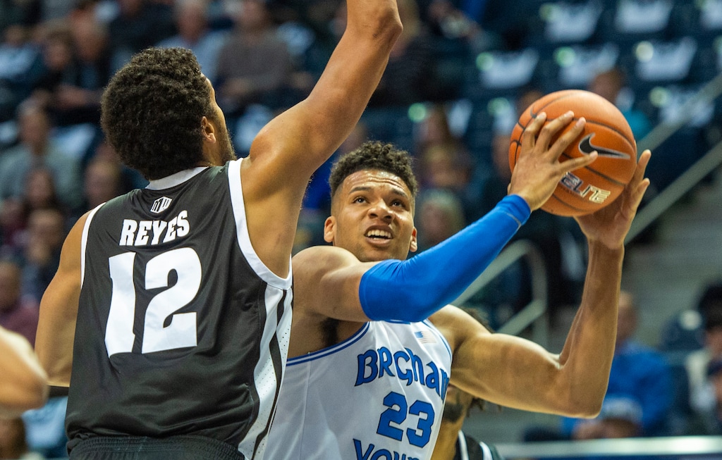 (Rick Egan | The Salt Lake Tribune) Brigham Young Cougars forward Yoeli Childs (23) tries to work the ball inside as Nevada Wolf Pack forward Johncarlos Reyes (12) defends in basketball action at the Marriott Center in Provo, Tuesday, Dec. 10, 2019.