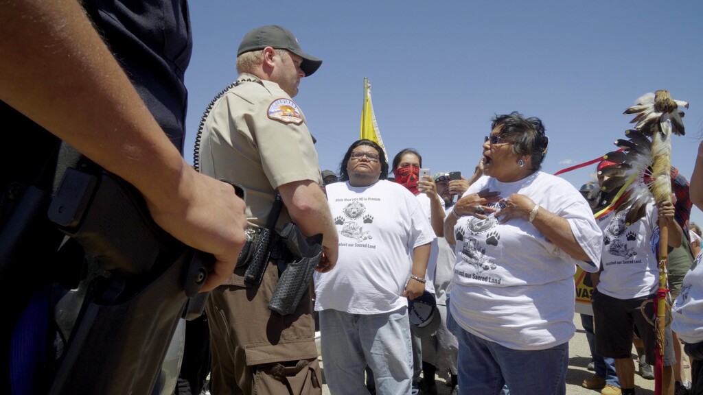 (Corey Robinson  |  Tribune file photo) Thelma Whiskers of the Ute Mountain Ute tribe confronts officers outside the gates of the White Mesa Mill during a protest on May 14, 2017.