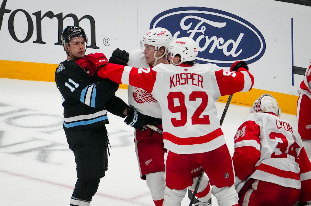 (Bethany Baker | The Salt Lake Tribune) Detroit Red Wings center Marco Kasper (92) and Detroit Red Wings defenseman Simon Edvinsson (77) scuffle with Utah Hockey Club right wing Dylan Guenther (11) at Delta Center in Salt Lake City on Monday, March 24, 2025.