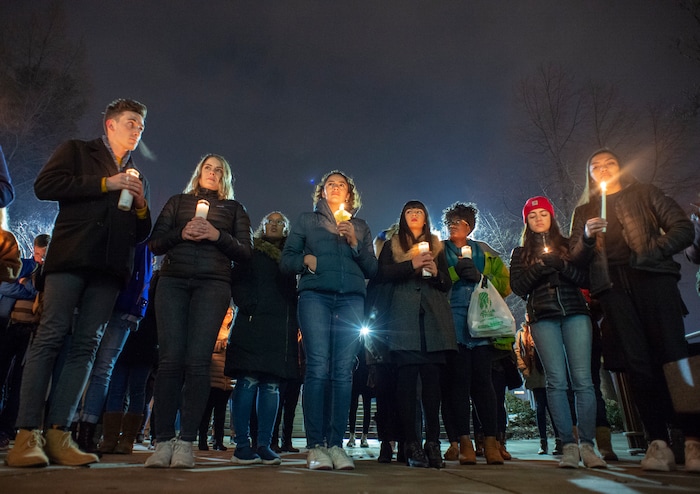 (Rick Egan  |  The Salt Lake Tribune)      BYU students gather for a candlelight vigil on BYU campus, for the student who died by suicide this week, at the Tanner Building, Friday, Dec. 7, 2018.
  
