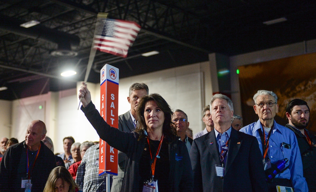 (Chris Samuels | The Salt Lake Tribune) Charlotte Bowerbank of Sandy waves an American flag after the playing of the National Anthem during the Utah Republican Party nominating convention on Saturday, April 23, 2022 in Sandy. Utah Republicans and Democrats will host their 2024 conventions this weekend.