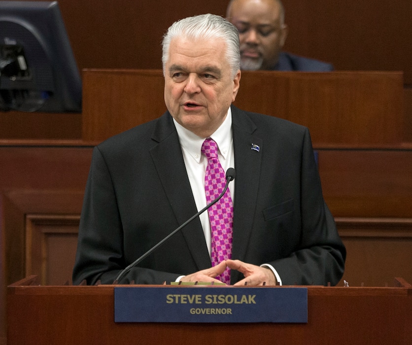 FILE - In this Jan. 16, 2019 file photo, Nevada Gov. Steve Sisolak delivers his State of the State address from the Assembly Chambers of the Nevada Legislature in Carson City, Nev. Nevada will not join other US states that have pledged their Electoral College votes to the presidential candidate who wins the national popular vote. Democratic Gov. Steve Sisolak announced Thursday, May 30, 2019, he had vetoed the measure. (AP Photo/Tom R. Smedes, File)