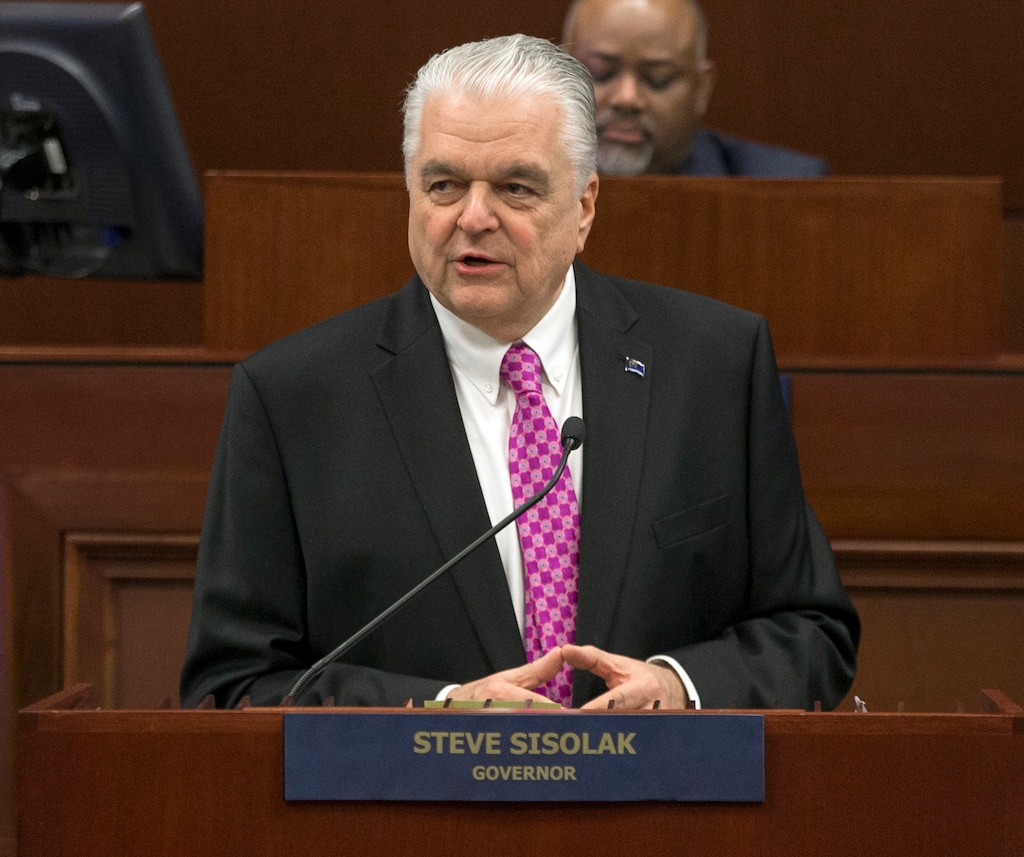 FILE - In this Jan. 16, 2019 file photo, Nevada Gov. Steve Sisolak delivers his State of the State address from the Assembly Chambers of the Nevada Legislature in Carson City, Nev. Nevada will not join other US states that have pledged their Electoral College votes to the presidential candidate who wins the national popular vote. Democratic Gov. Steve Sisolak announced Thursday, May 30, 2019, he had vetoed the measure. (AP Photo/Tom R. Smedes, File)