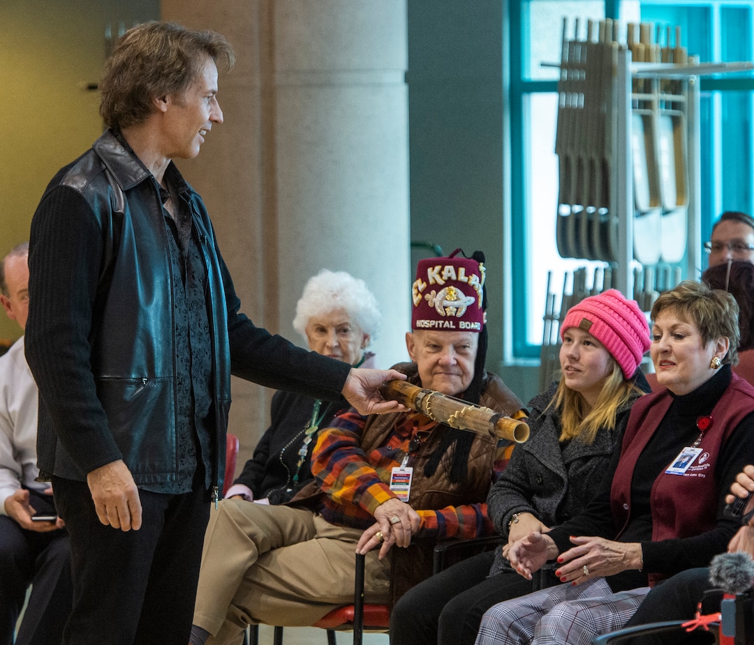 (Rick Egan  |  The Salt Lake Tribune)    Kurt Bestor entertains the crowd at Shriners' Hospital passing around instruments he has collected from around the world. Tuesday, Nov. 19, 2019.