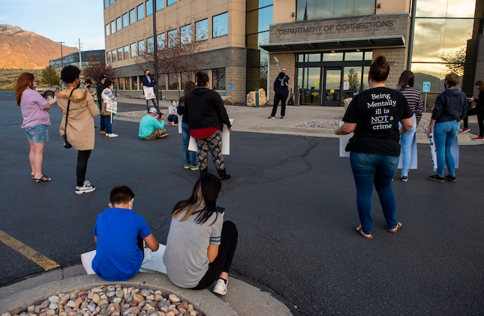 (Rick Egan  |  The Salt Lake Tribune)  Protesters gather for a rally for prison inmates at the Department of Corrections, after a COVID-19 outbreak has spread at the Draper prison, on Tuesday, Oct. 13, 2020.
