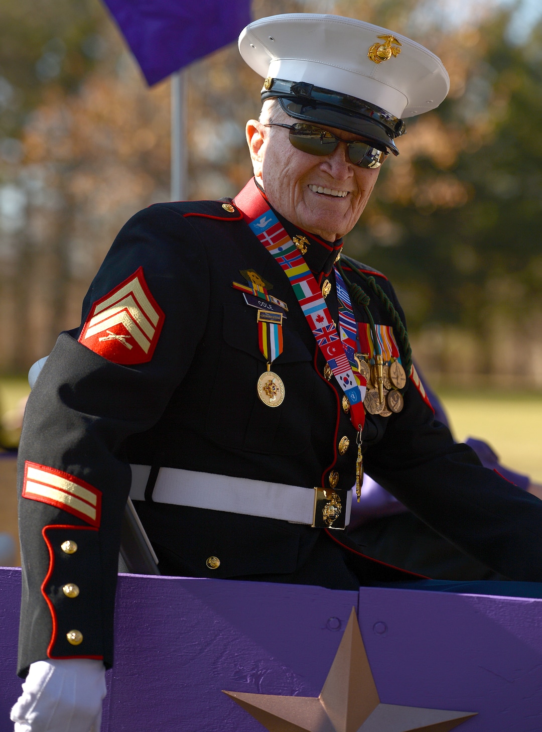 (Leah Hogsten  |  The Salt Lake Tribune) A Marine survivor of the Battle of Chosin Reservoir during the Korean War, John Cole rides with other veterans awarded the Purple Heart during Northern Utah’s 12th Annual Veterans Day Parade Saturday, Nov. 11, 2017 in Layton.