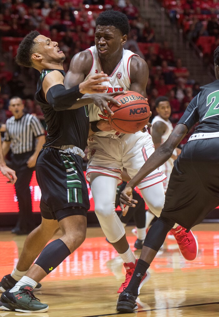 (Rick Egan  |  The Salt Lake Tribune)  Utah Utes forward Donnie Tillman (3) tries to get past Hawaii Warriors guard Drew Buggs (1), in basketball action, Utah Utes vs Hawaii Warriors, at the Jon M. Huntsman Center, Saturday, December 2, 2017.