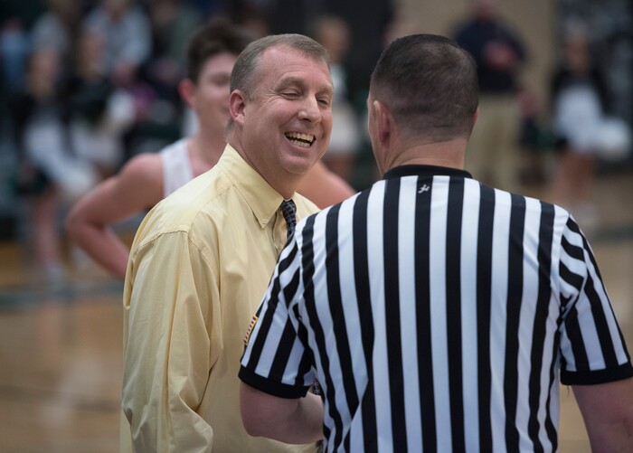 (Scott Sommerdorf   |  The Salt Lake Tribune)   Olympus basketball coach Matt Barnes jokes with an official during a second half play stoppage as his Titans defeated Highland 70-49, Friday, January 19, 2018.