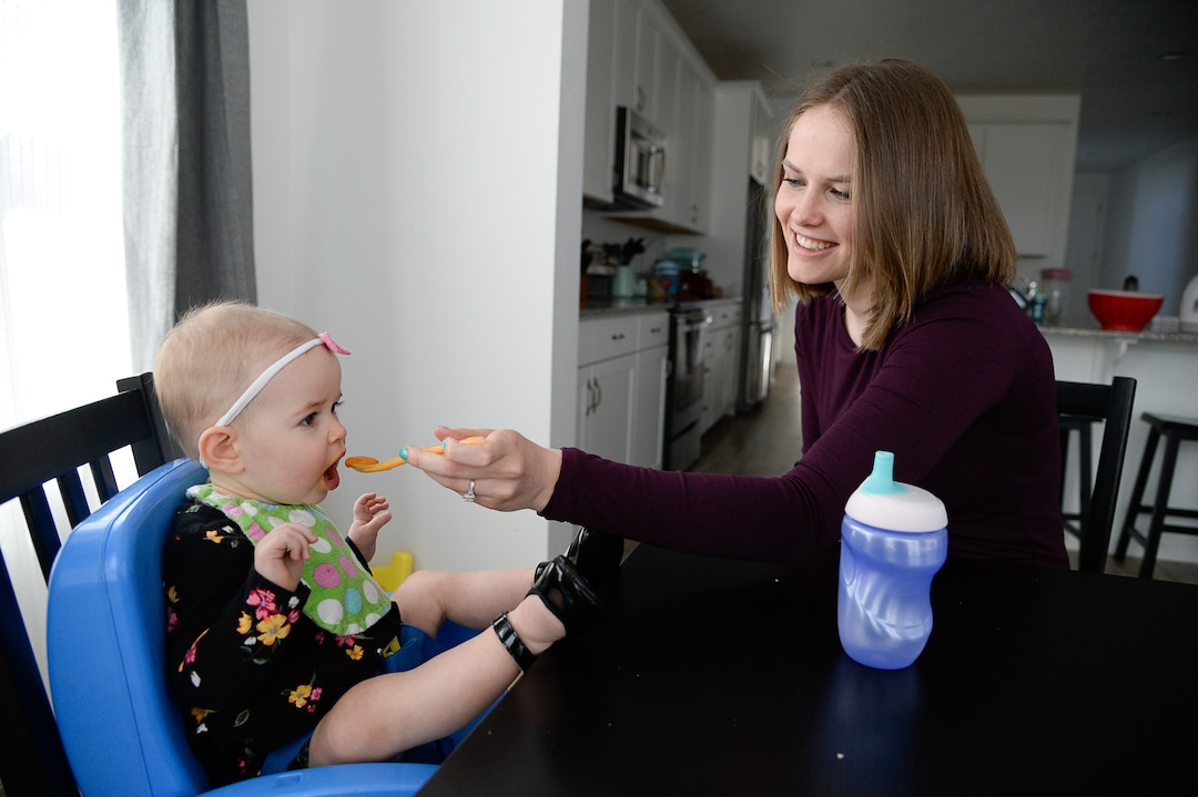 (Francisco Kjolseth  |  The Salt Lake Tribune)  Ember Ulrich feeds her daughter Jemma, 1, at their home in Lehi during the lunch hour. Ember and her husband Jeremy moved in last October from from Pleasant Grove because they could get more house for their money there, and it's closer to Jeremy's job at Adobe in Lehi.