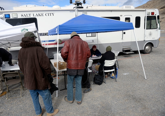(Al Hartmann  |  The Salt Lake Tribune) 	
Salt Lake City Police, Volunteers of America, Utah Highway Patrol, and social workers from Salt Lake City and the Veterans Administration set up a mobile outreach center along Victory Road north of the state Capitol building to help provide services to homeless camped in the hills near a gravel quarry.