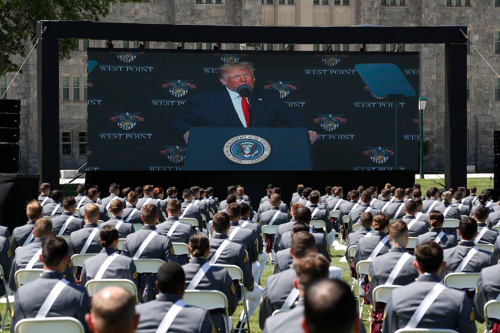 (Alex Brandon | AP file photo) A screen displays President Donald Trump as he speaks to over 1,110 cadets in the Class of 2020 at a commencement ceremony on the parade field, at the United States Military Academy in West Point, N.Y., Saturday, June 13, 2020.
