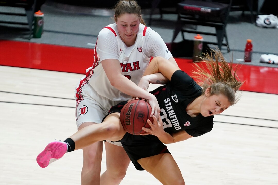 Utah forward Andrea Torres, rear, and Stanford guard Hannah Jump (33) battle for a rebound in the second half during an NCAA college basketball game Friday, Jan. 15, 2021, in Salt Lake City. (AP Photo/Rick Bowmer)