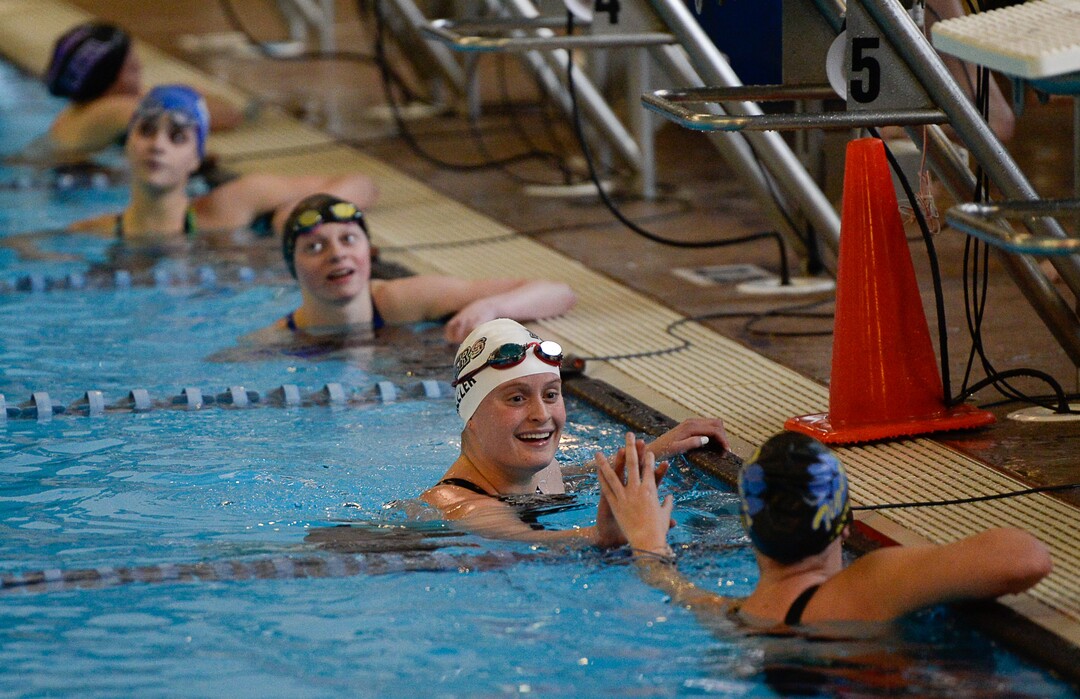 (Francisco Kjolseth  |  The Salt Lake Tribune)  Elise Weller of Park City is congratulated on her first place finish in the Women 200 Yard IM at the high school swimming 4A State Championships in Bountiful, Friday February 9, 2018.