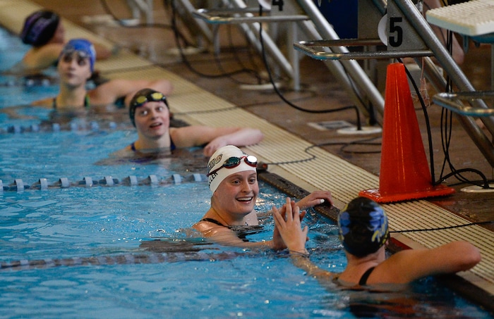 (Francisco Kjolseth  |  The Salt Lake Tribune)  Elise Weller of Park City is congratulated on her first place finish in the Women 200 Yard IM at the high school swimming 4A State Championships in Bountiful, Friday February 9, 2018.