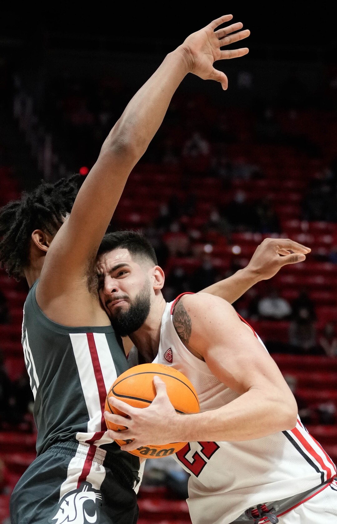 (Francisco Kjolseth | The Salt Lake Tribune) Washington State Cougars center Dishon Jackson (21) blocks Utah Utes forward Dusan Mahorcic (21) in game action during an NCAA college basketball game at the Jon M.Huntsman Center, on Saturday, Jan. 8, 2022. Utah lost 61-77.