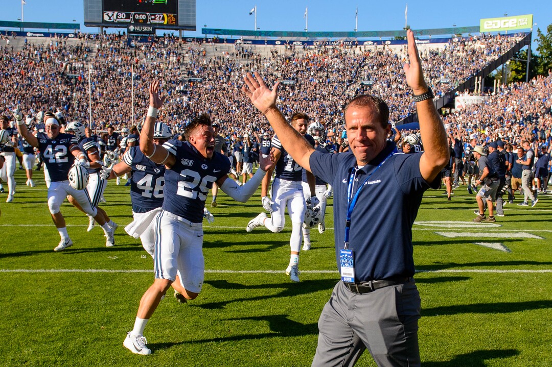 (Trent Nelson  |  The Salt Lake Tribune)  BYU fans rush the field to celebrate the overtime win as BYU hosts USC, NCAA football in Provo on Saturday Sept. 14, 2019.