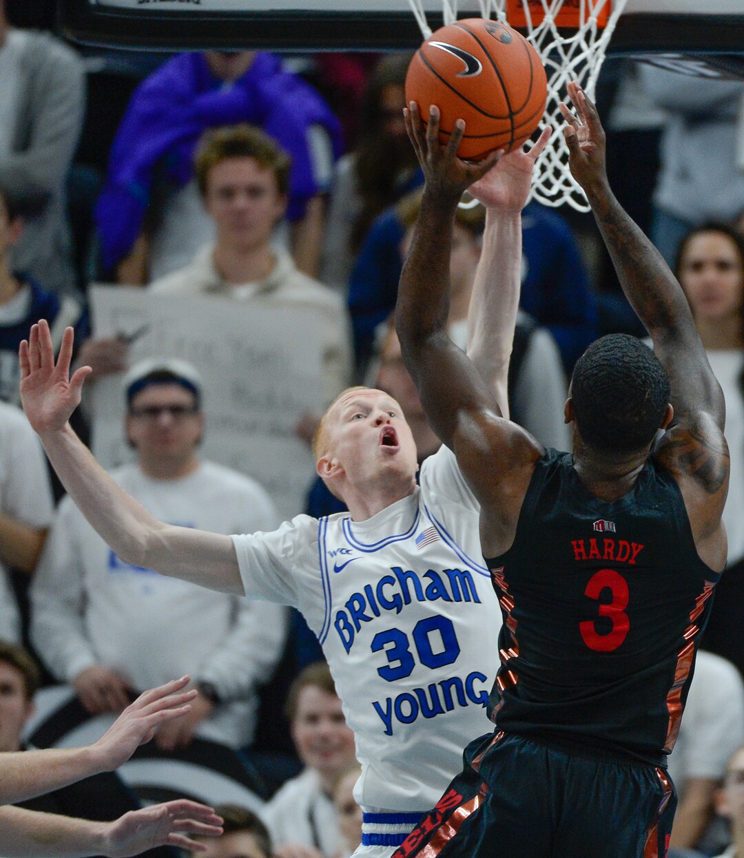 (Francisco Kjolseth  |  The Salt Lake Tribune)  Brigham Young Cougars guard TJ Haws (30) puts the pressure on UNLV Rebels guard Amauri Hardy (3) as BYU takes on UNLV in men's NCAA basketball at Vivint Smart Home Arena in Salt Lake City on Sat. Dec. 7, 2019.