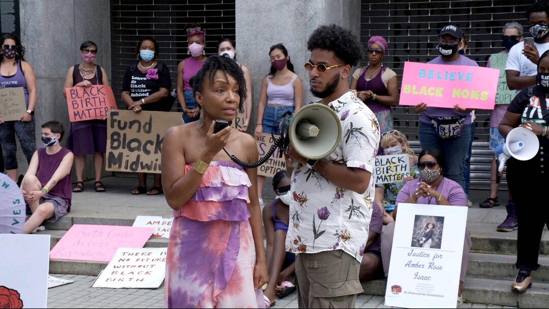 (Kerwin Devonish  |  Sundance Institute) Shawnee Benton Gibson and Bruce McIntyre lead a protest to support maternal care, in the documentary "Aftershock," directed by Paula Eiselt and Tonya Lewis Lee, an official selection of the U.S. Documentary competition at the 2022 Sundance Film Festival.