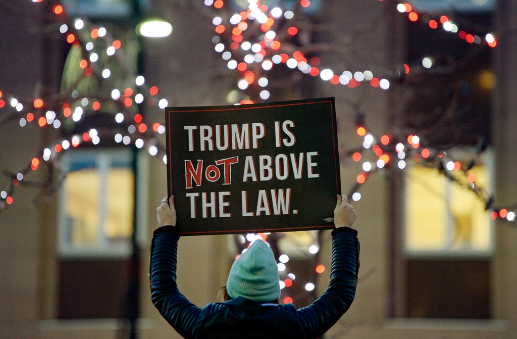 (Francisco Kjolseth | The Salt Lake Tribune) Alyssa Stauffer joins other activists as they gather outside the Wallace F. Bennett Federal Building on Tuesday, Dec. 17, 2019, as part of the nationwide “Nobody Is Above the Law” rallies, the day before the U.S. House of Representatives votes to impeach Donald Trump for high crimes and misdemeanors. The rally in Salt Lake City is one of more than 500 rallies occurring nationwide in all 50 states.