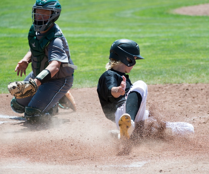 (Rick Egan  |  The Salt Lake Tribune)   Connor Hughes, Jordan High slides past Olympus Catcher AJ Affleck to score for Jordan, in the 5A state baseball championship game, at UVU in Orem, Friday, May 25, 2018.
