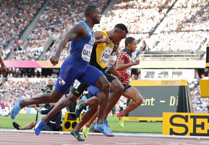 United States' Justin Gatlin, Jamaica's Julian Forte and Japan's Aska Cambridge, from left, cross the line of a men's 100m semifinal during the World Athletics Championships in London Saturday, Aug. 5, 2017. (AP Photo/Matt Dunham)