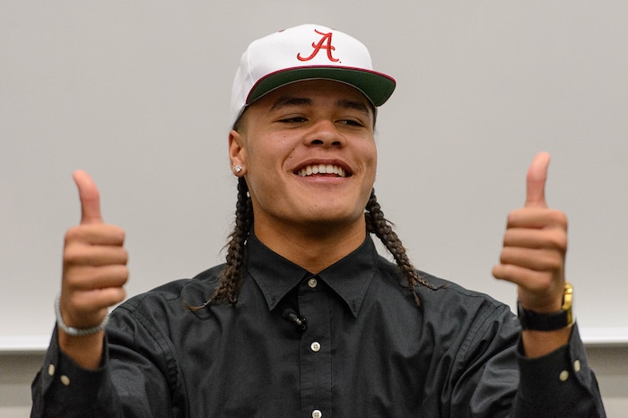 (Trent Nelson  |  The Salt Lake Tribune)  Olympus tight end Cameron Latu announces he's headed to Alabama during a news conference at Olympus High School in Salt Lake City Friday August 4, 2017.